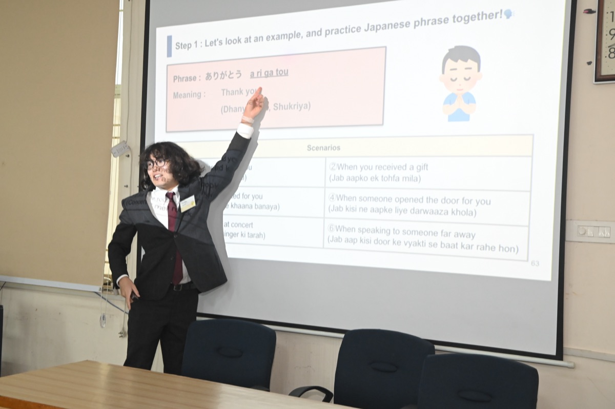 Teacher presenting Japanese phrases in an interactive classroom session
